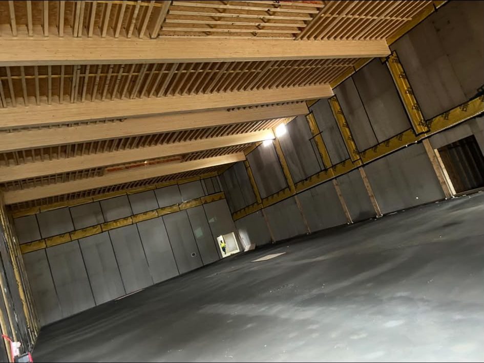 Exposed timber joist ceiling over a finished floor slab