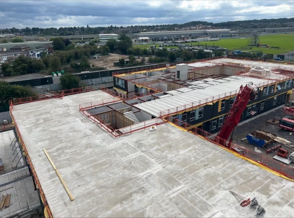 Commercial roof deck boarded out with the crane on site